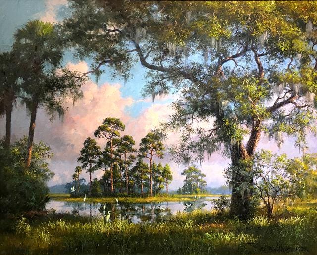 A serene landscape of a swamp area with tall trees, lush grass, and a reflective body of water under a partly cloudy sky. Egrets are scattered throughout the scene.